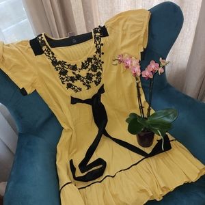 Yellow midi dress with velvet applique detail from Anthropologie size 10.